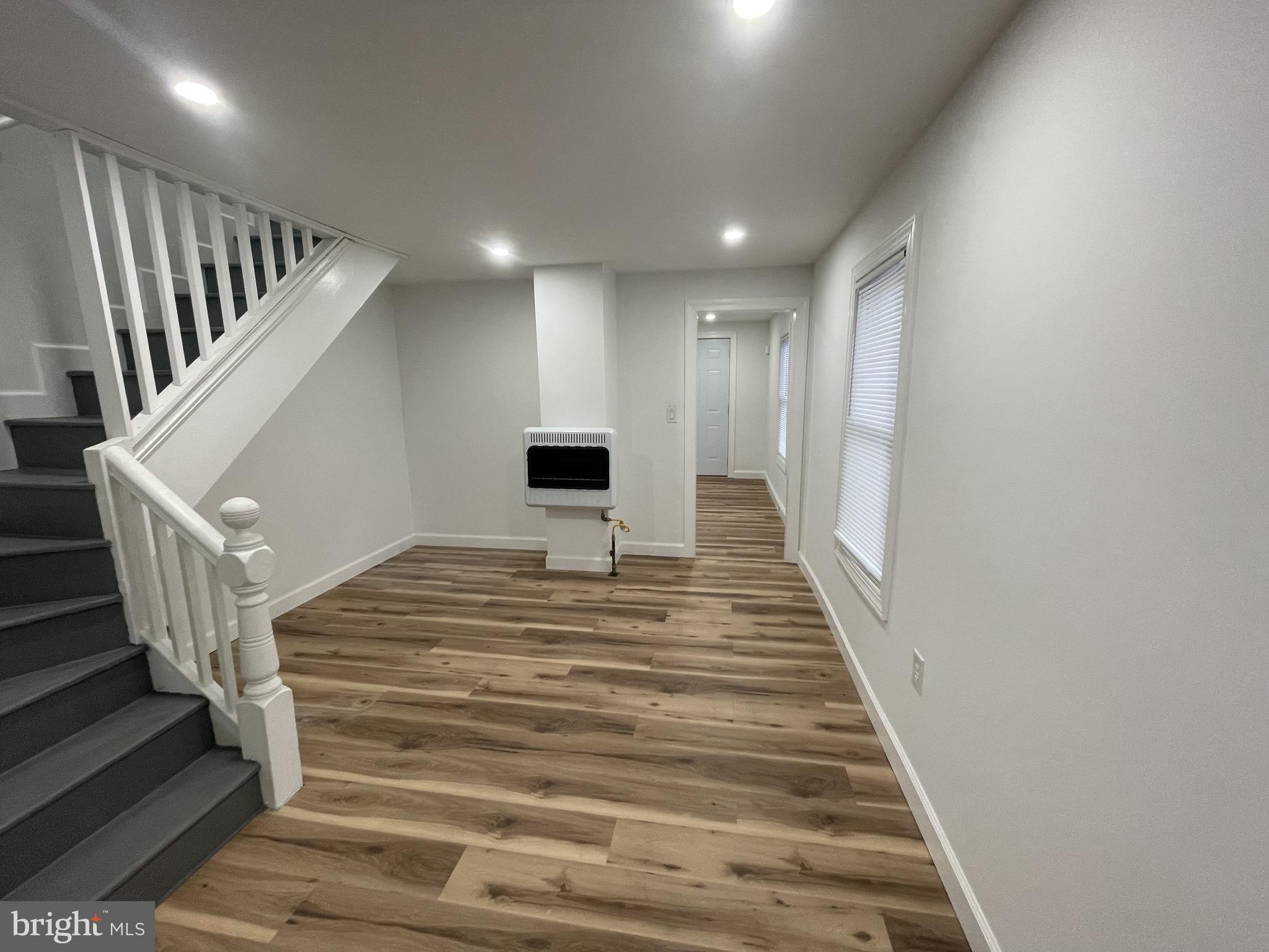 628-630 High Street Cambridge, MD 21613 - Photo 3 of 16 a view of entryway and hall with wooden floor