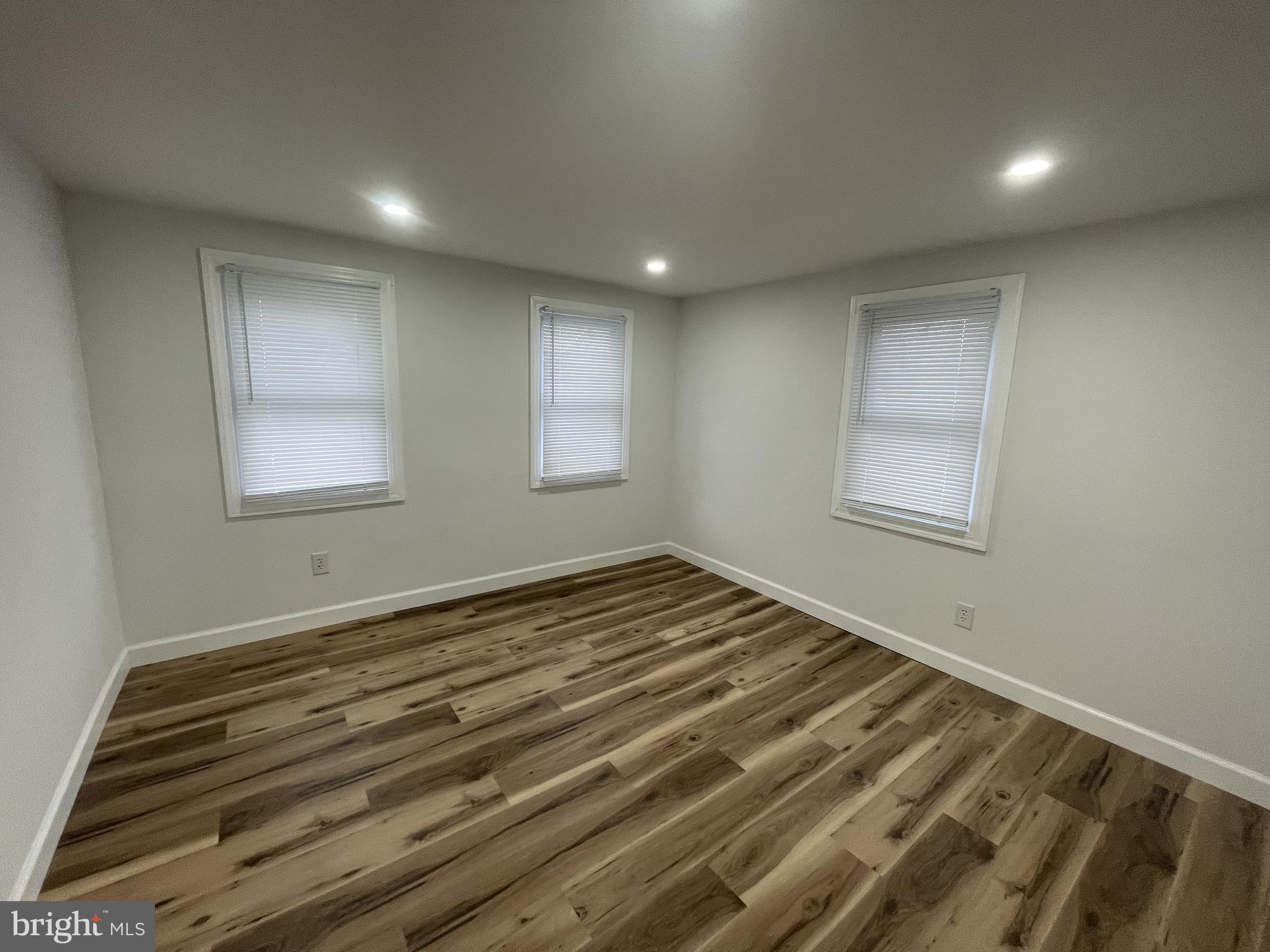 628-630 High Street Cambridge, MD 21613 - Photo 8 of 16 a view of a room with wooden floor and window