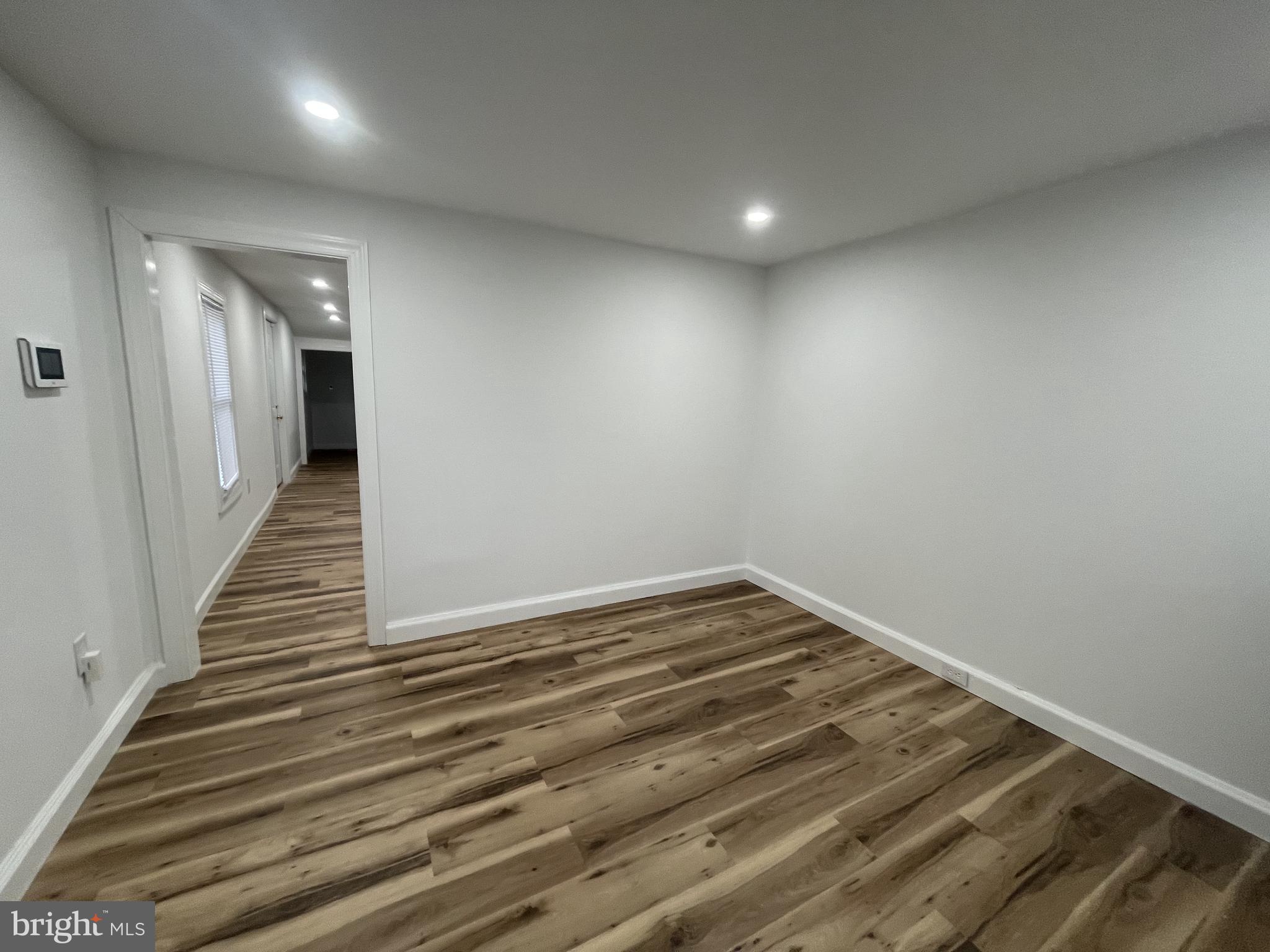 628-630 High Street Cambridge, MD 21613 - Photo 9 of 16 a view of a hallway with wooden floor