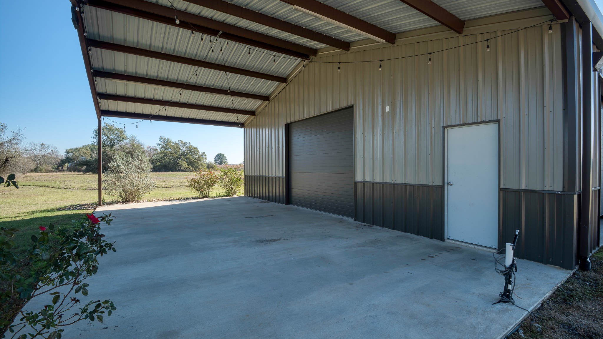 40934 Thomas Lane Hempstead, TX 77445 - Photo 33 of 50 20x40 rear porch with electric & water stubbed in.