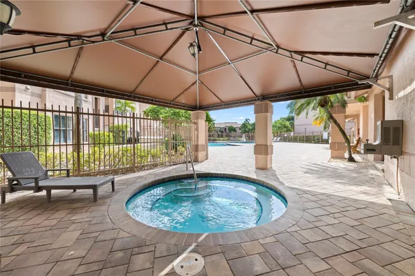a view of a swimming pool with a patio