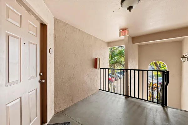 a view of a hallway with windows