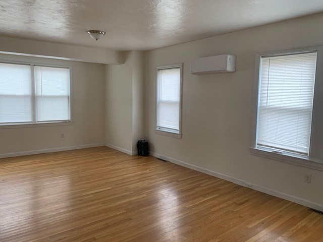 2284 Cranberry Highway Wareham, MA 02576 - Photo 3 of 12 a view of an empty room with wooden floor and a window
