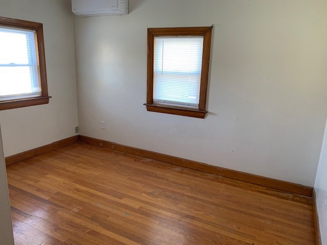 2284 Cranberry Highway Wareham, MA 02576 - Photo 6 of 12 an empty room with wooden floor and windows
