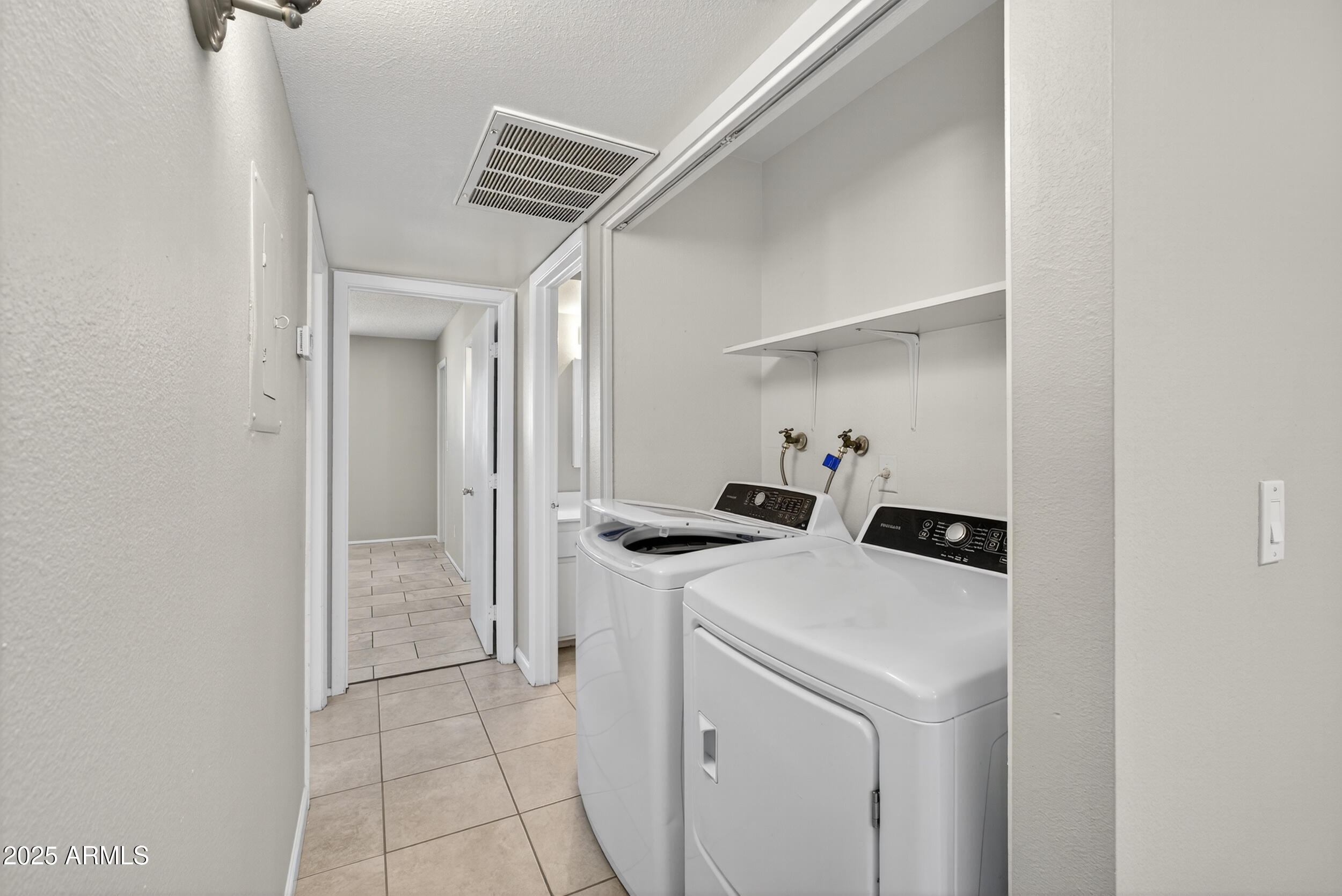 860 East Brown Road, Unit 67 Mesa, AZ 85203 - Photo 12 of 27 a room with storage and utility