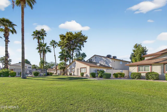 a front view of house with yard and trees