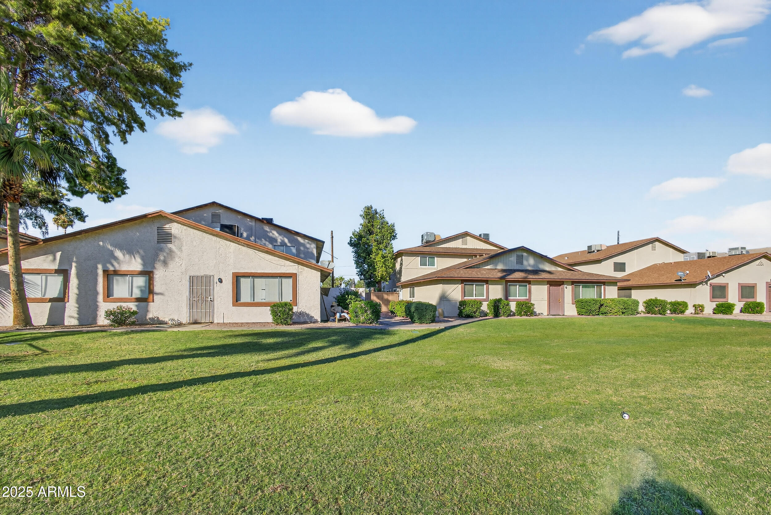 860 East Brown Road, Unit 67 Mesa, AZ 85203 - Photo 26 of 27 a front view of a house with a garden