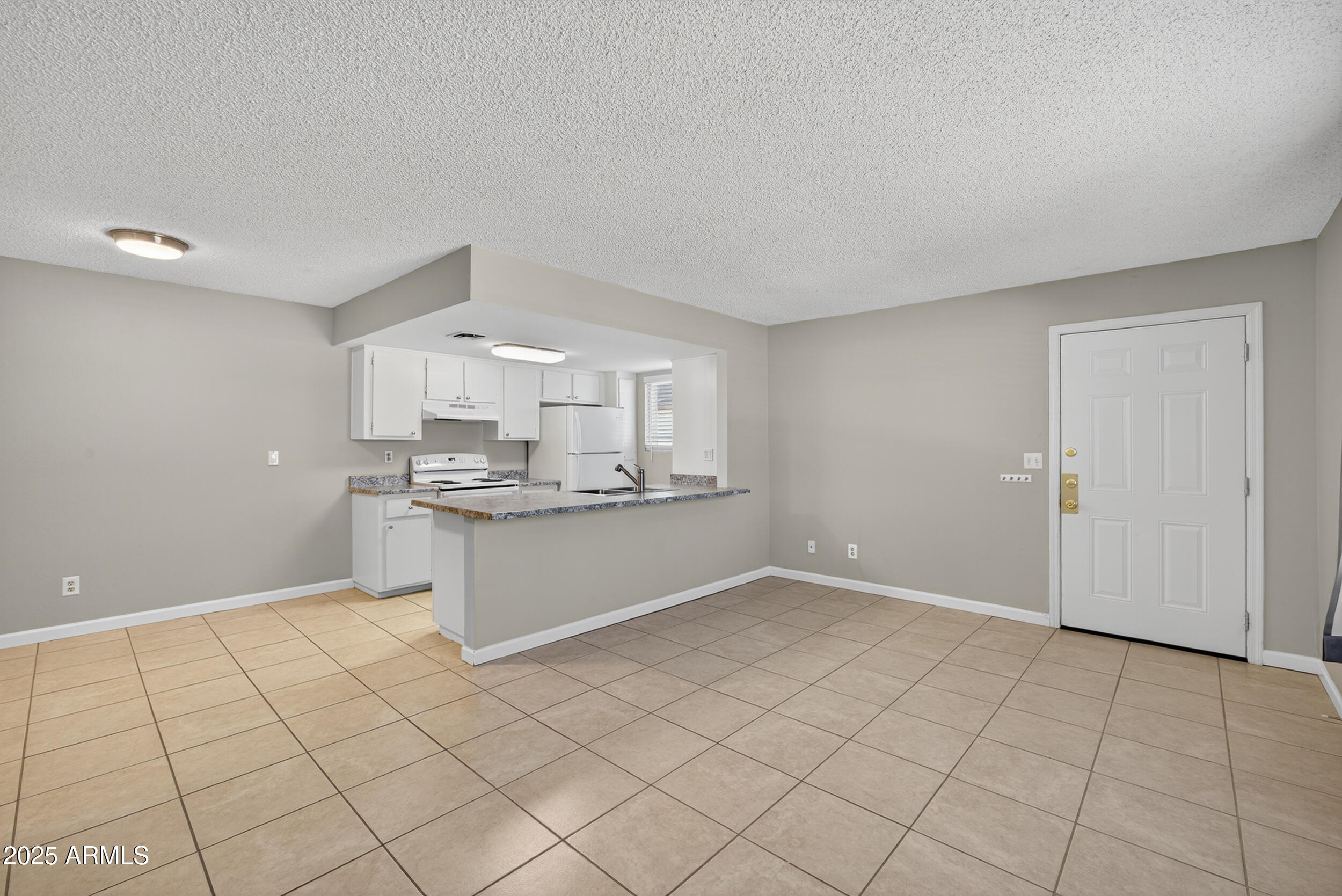 860 East Brown Road, Unit 67 Mesa, AZ 85203 - Photo 5 of 27 a kitchen with a sink cabinets and counter space