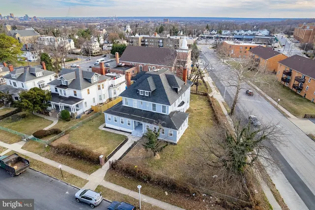 an aerial view of residential houses with outdoor space