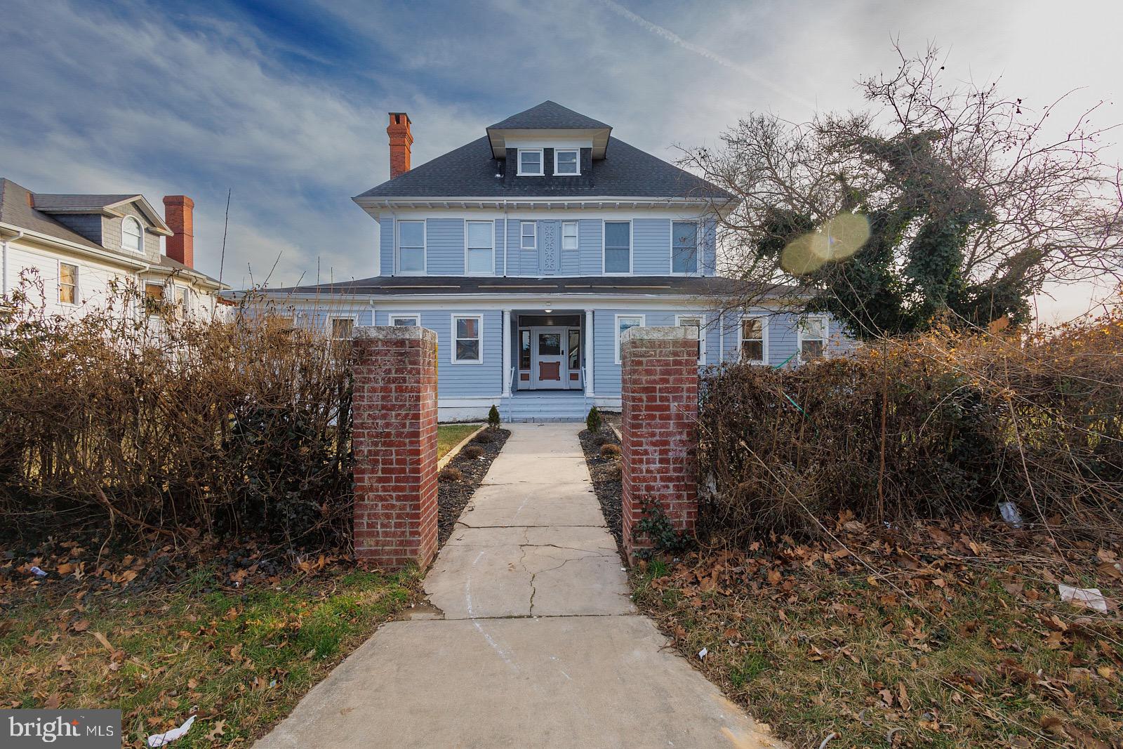 3407 Elgin Avenue, Unit 1 Baltimore, MD 21216 - Photo 2 of 15 a front view of a house with yard