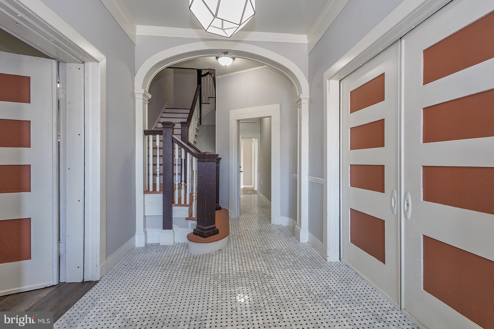 3407 Elgin Avenue, Unit 1 Baltimore, MD 21216 - Photo 3 of 15 a view of entryway and hallway with a front door