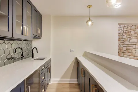a bathroom with a double vanity sink mirror and toilet