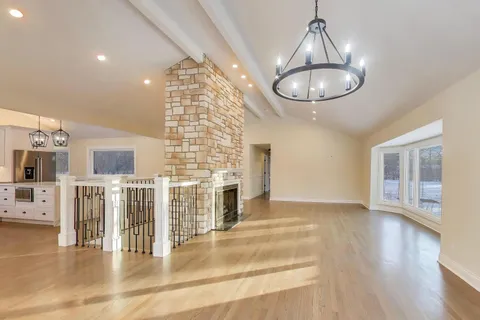 a kitchen with stainless steel appliances a stove sink and cabinets