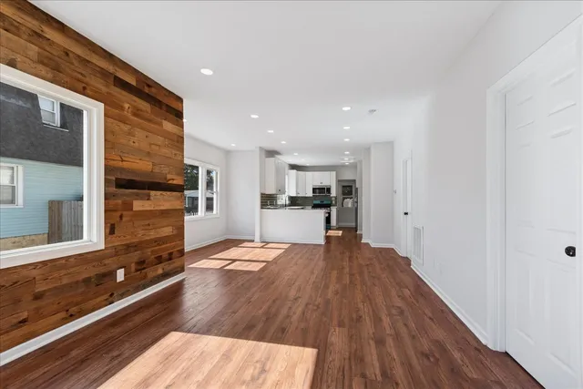 a view of kitchen with sink microwave and refrigerator
