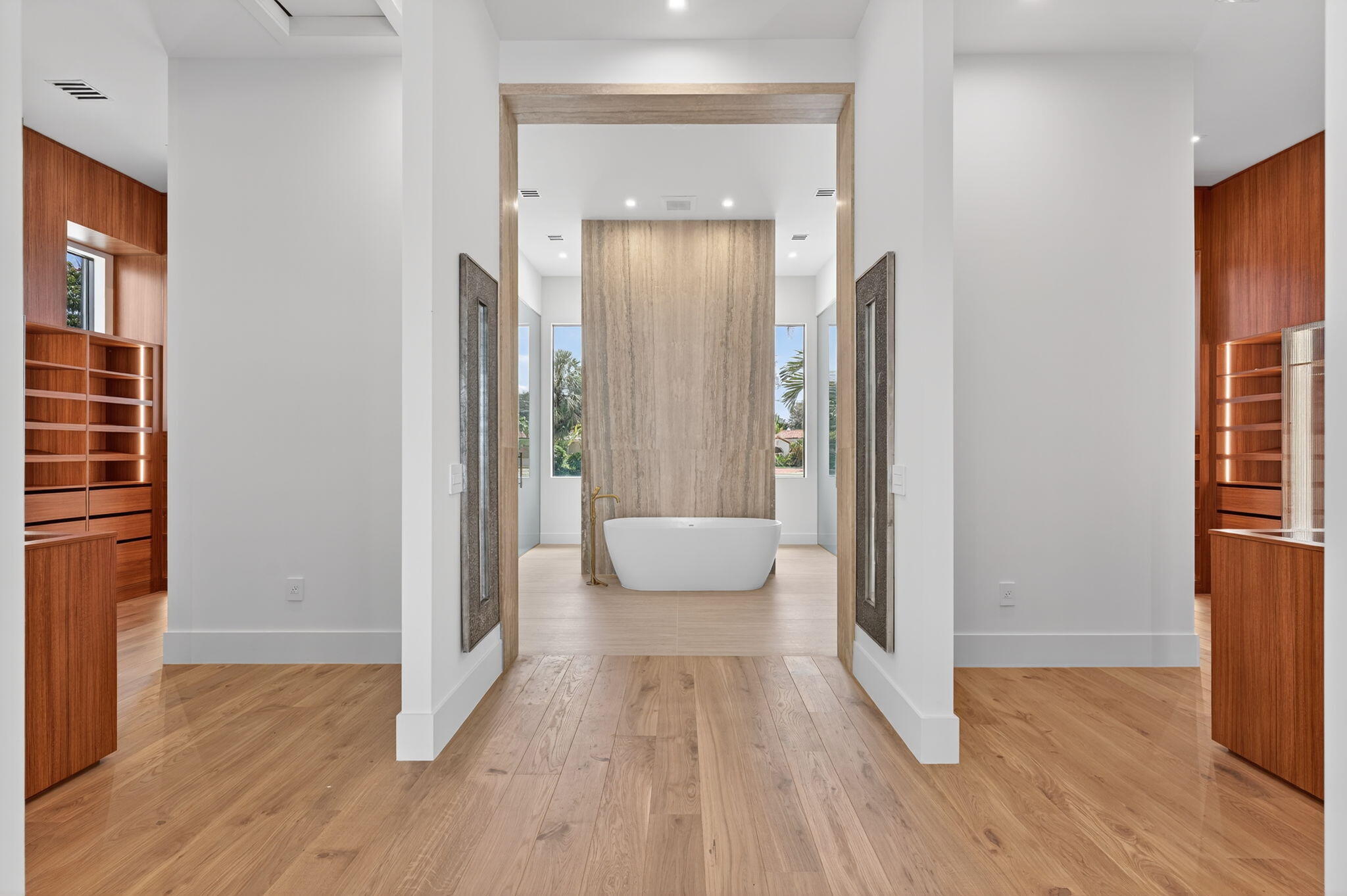 721 Northeast 34th Street Boca Raton, FL 33431 - Photo 35 of 76 a view of a hallway with wooden floor and a livingroom