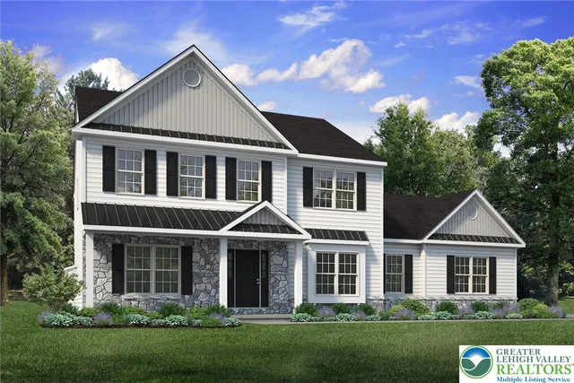 front view of a house with a yard