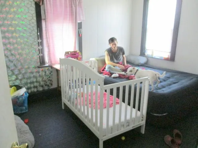 a bedroom with furniture and a window