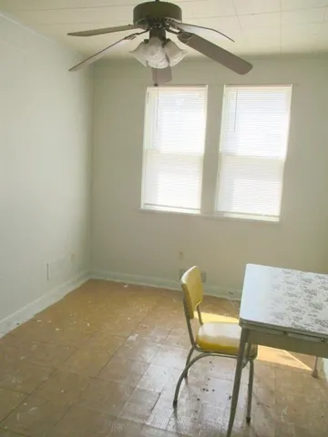 a room with a white cabinets and a window