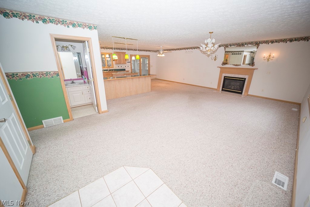 48120 Cooper Foster Park Road Amherst, OH 44001 - Photo 2 of 29 View walking in the from door looking into the Main living area, kitchen, dining room and into the sliding door of the 4 season room.