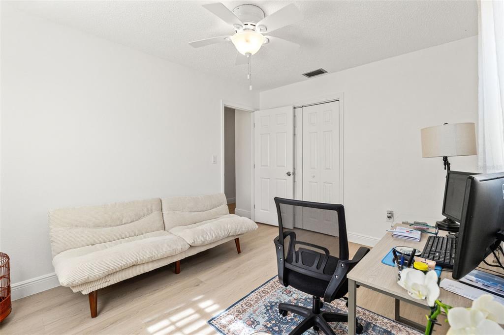 8306 Needles Drive Hudson, FL 34667 - Photo 20 of 39 a living room with furniture and a flat screen tv