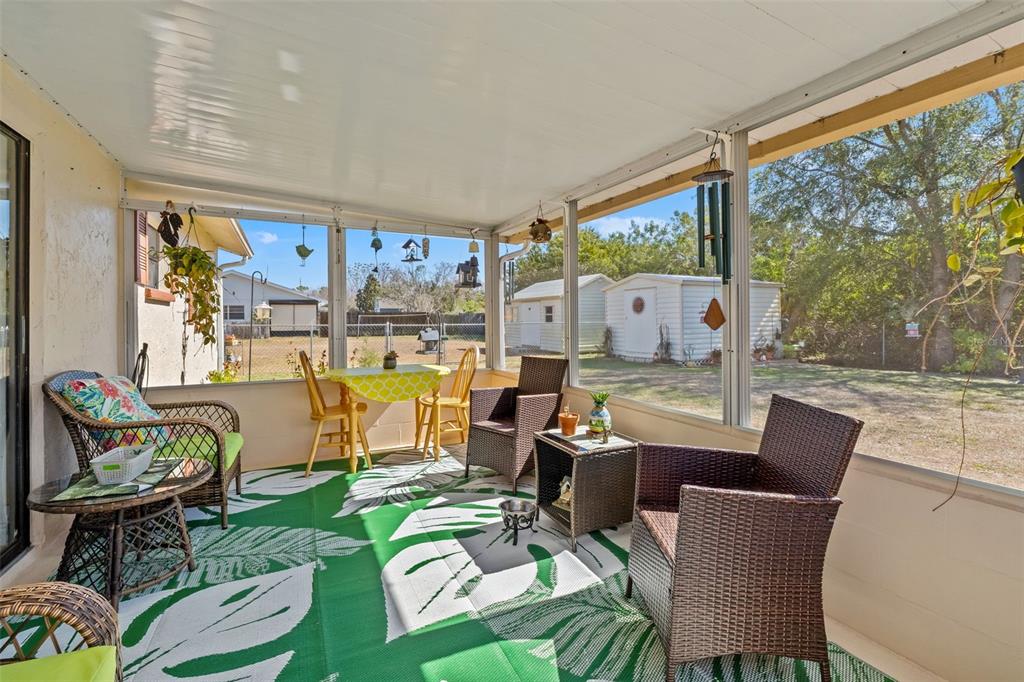 8306 Needles Drive Hudson, FL 34667 - Photo 24 of 39 a living room with furniture and a large window