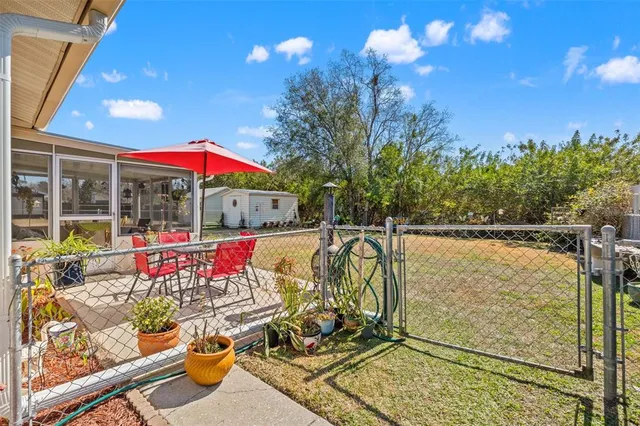 a view of swimming pool with sitting area