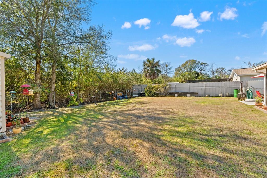 8306 Needles Drive Hudson, FL 34667 - Photo 33 of 39 a view of a house with a yard