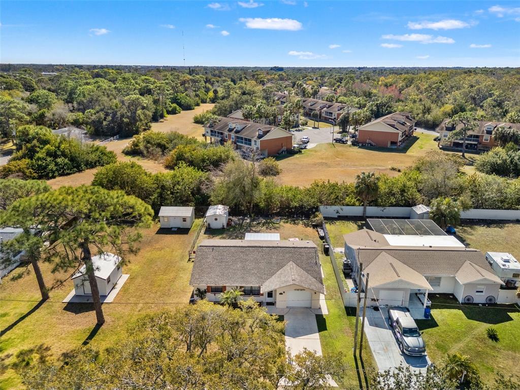 8306 Needles Drive Hudson, FL 34667 - Photo 37 of 39 an aerial view of residential houses with outdoor space