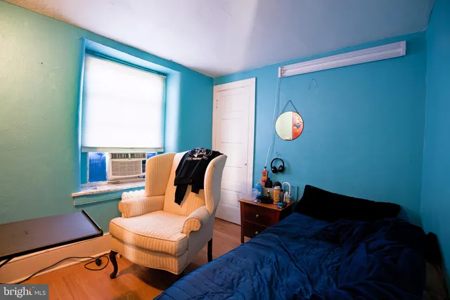 a bed room with a bed and a window