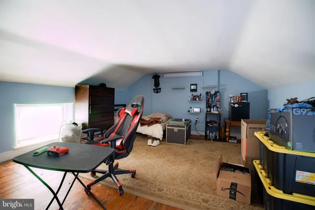 a room with furniture and air hockey table