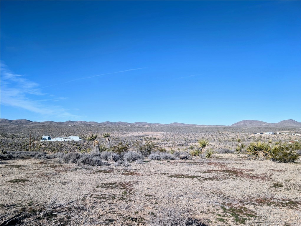 27071 Rainbow Road Meadview, AZ 86444 - Photo 4 of 11 View of mountain backdrop with a desert landscape