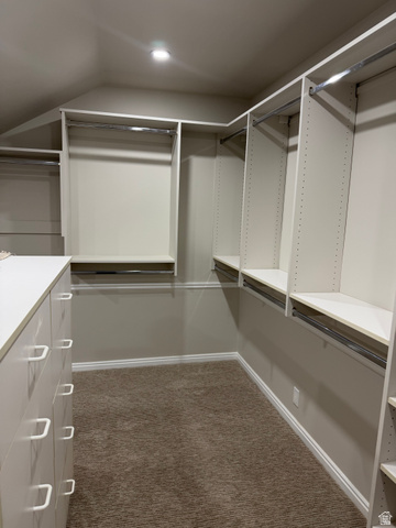 8965 Quail Run Drive Sandy, UT 84093 - Photo 36 of 56 Walk in closet featuring dark colored carpet and lofted ceiling