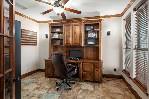 a view of workspace with a window and furniture