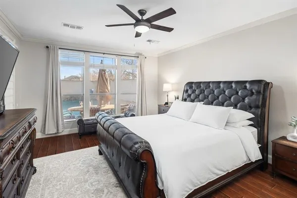 a bed sitting in a bedroom next to a window