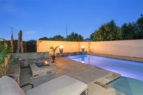 a view of a terrace with couches and sky view