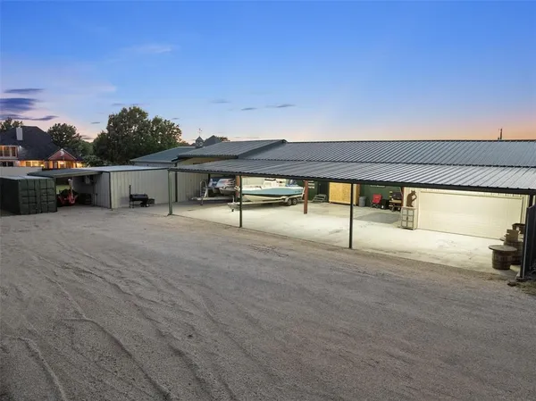 a view of swimming pool with outdoor seating and yard in back