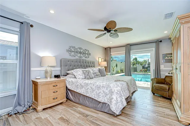 a living room with a couch and a wooden floor