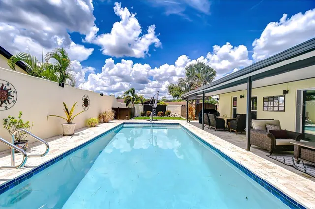 a front view of a house with a yard and a garage
