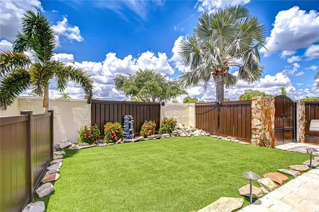 a view of a park with a large tree