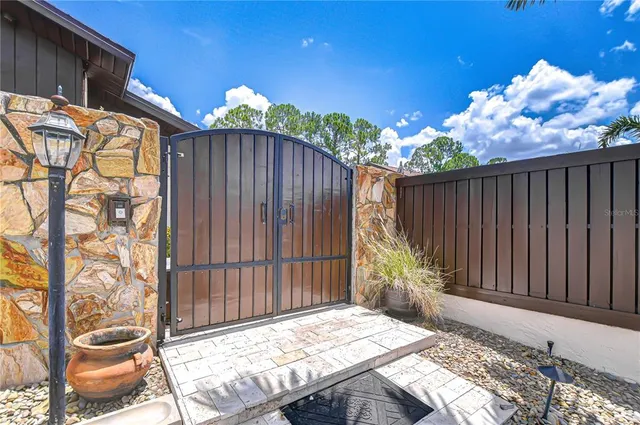 a view of a swimming pool with a patio