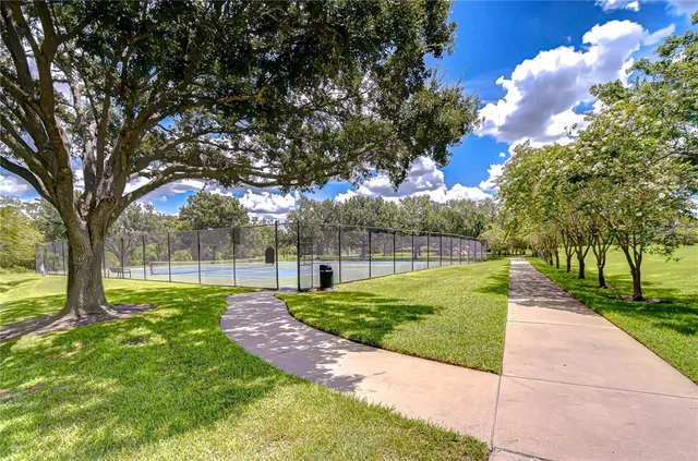 a view of swimming pool with sitting area