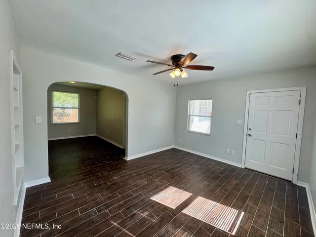 a kitchen with stainless steel appliances granite countertop a refrigerator and a stove