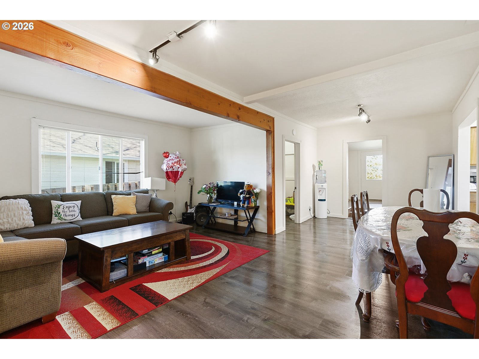 320 East Steuben Street Bingen, WA 98605 - Photo 12 of 41 a living room with furniture a rug and a chandelier