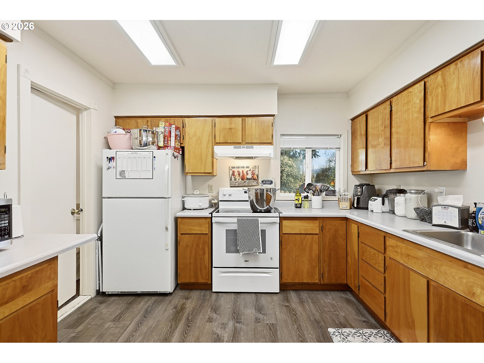 320 East Steuben Street Bingen, WA 98605 - Photo 14 of 41 a kitchen with white cabinets and white appliances