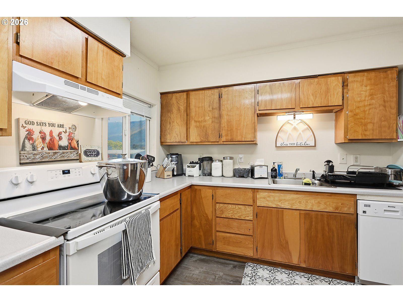 320 East Steuben Street Bingen, WA 98605 - Photo 15 of 41 a kitchen with stainless steel appliances a sink a stove and cabinets
