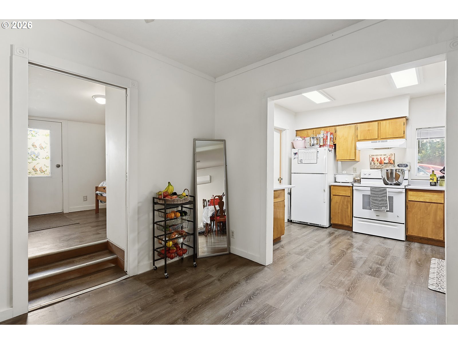 320 East Steuben Street Bingen, WA 98605 - Photo 16 of 41 a view of a kitchen with refrigerator and wooden floor