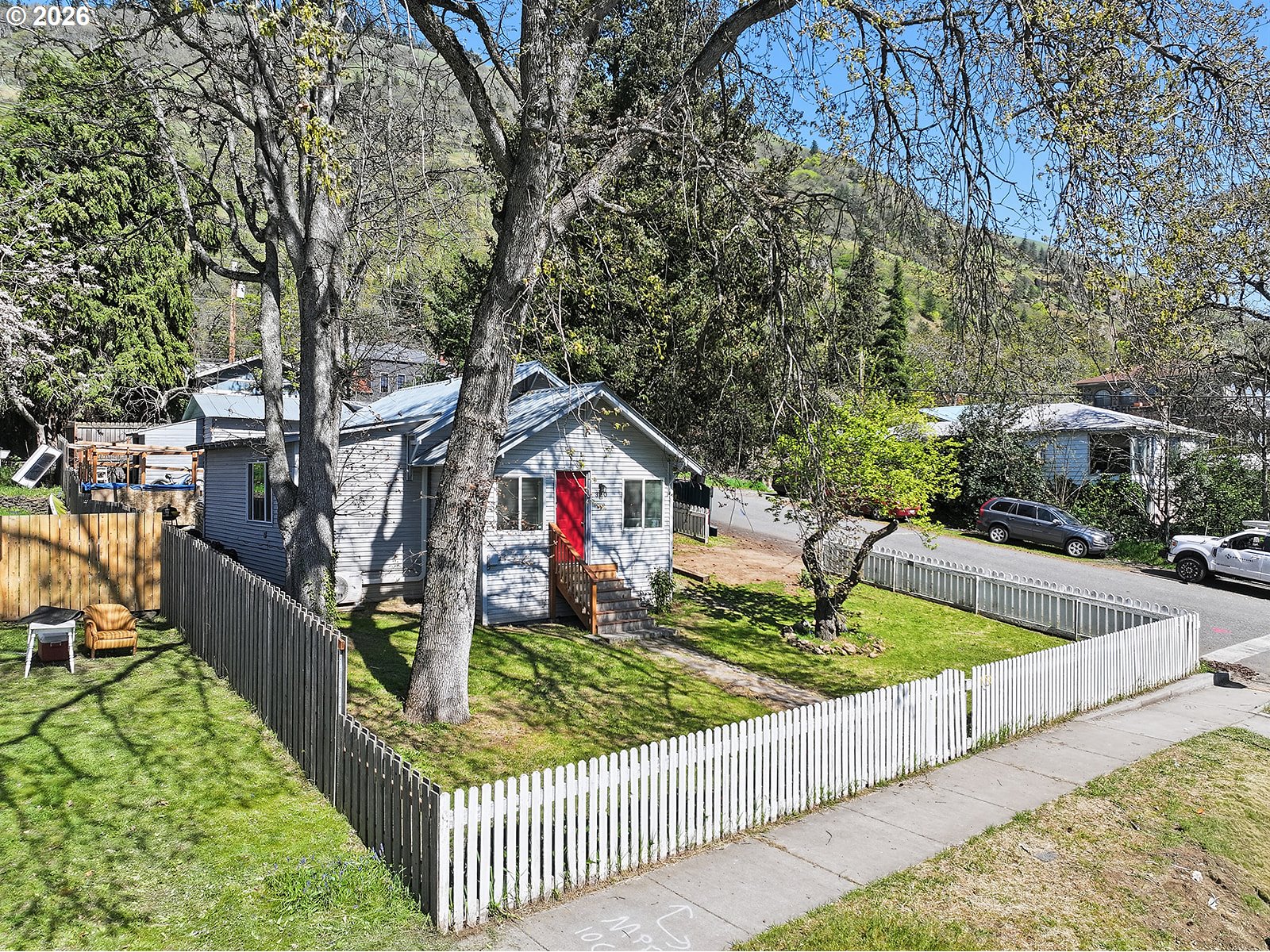 320 East Steuben Street Bingen, WA 98605 - Photo 3 of 41 a view of house along with trees and stairs