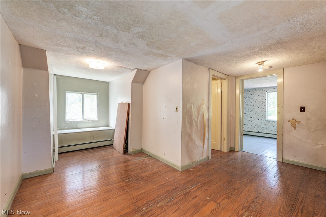 343 Bellus Road Hinckley, OH 44233 - Photo 33 of 49 Upstairs open area between bedrooms. Hardwood flooring