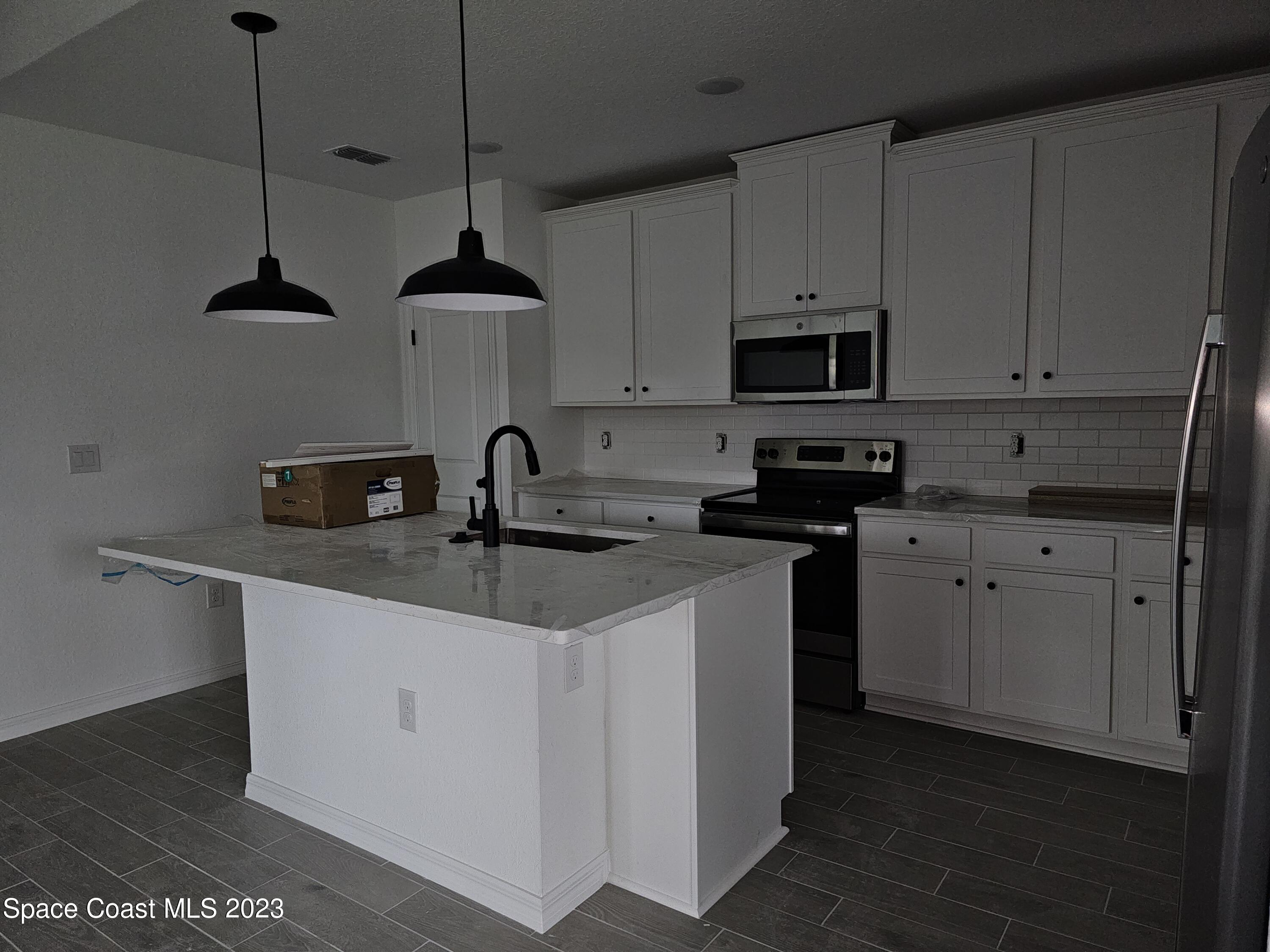 1302 Zanzibar Road Southeast Palm Bay, FL 32909 - Photo 2 of 10 20231127_111310