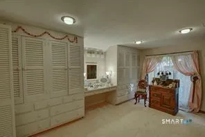 a bathroom with double vanity and a shower